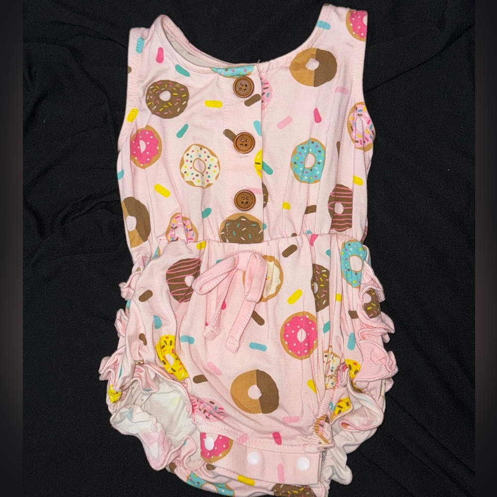 Girls romper with sprinkled donuts with a ruffled butt